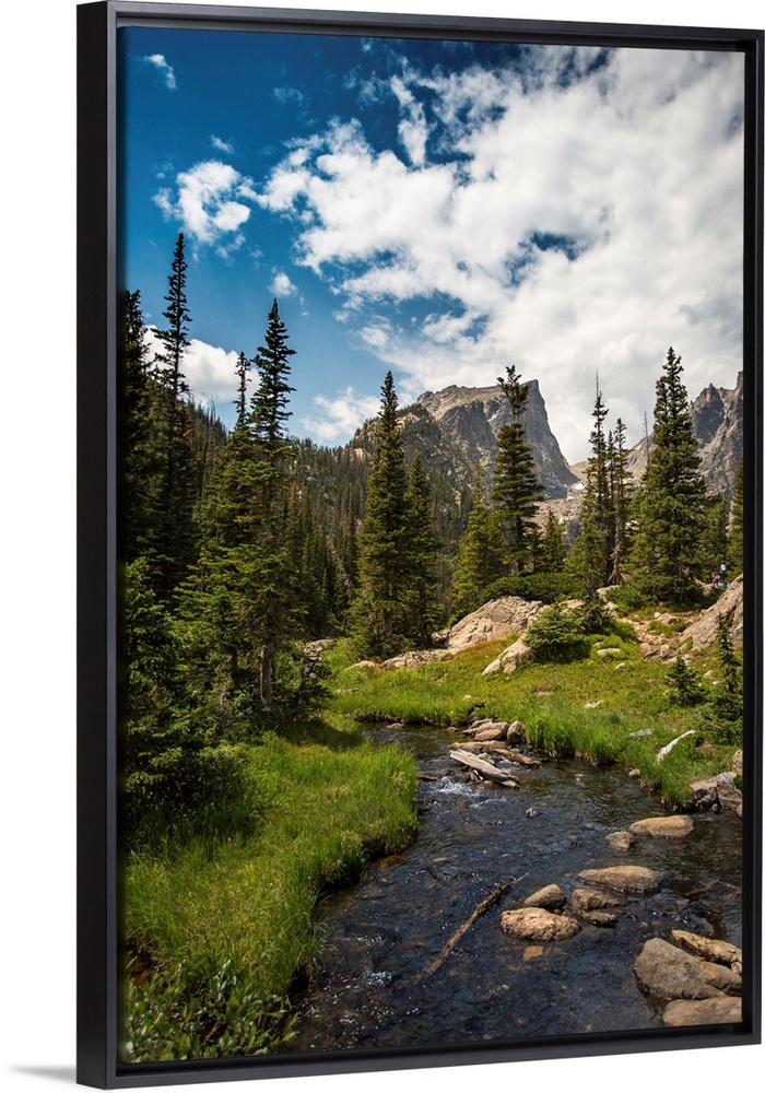 Landscape photograph of a stream going through Rocky Mountain National Park on a beautiful day.