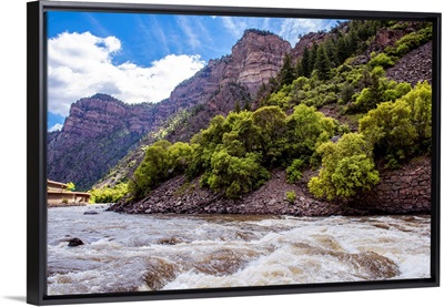 Rushing River under a Mountain Cliffside in Colorado