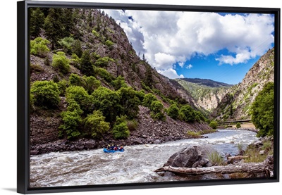 Rushing River under a Mountain Cliffside in Colorado