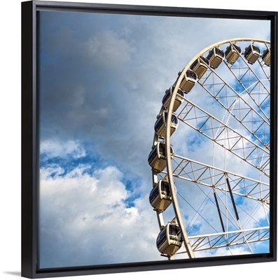 SkyView Atlanta, a giant Ferris Wheel in Centennial Park, against a cloudy sky.