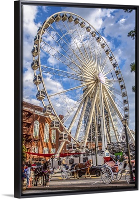 SkyView Atlanta towering over horses and carriages in Centennial Park