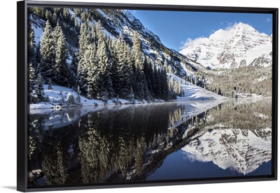 Snowy Maroon Bells mirrored in Maroon Lake below, Aspen, Colorado