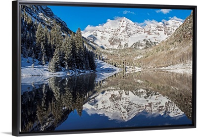 Snowy Maroon Bells mirrored in Maroon Lake below, Aspen, Colorado