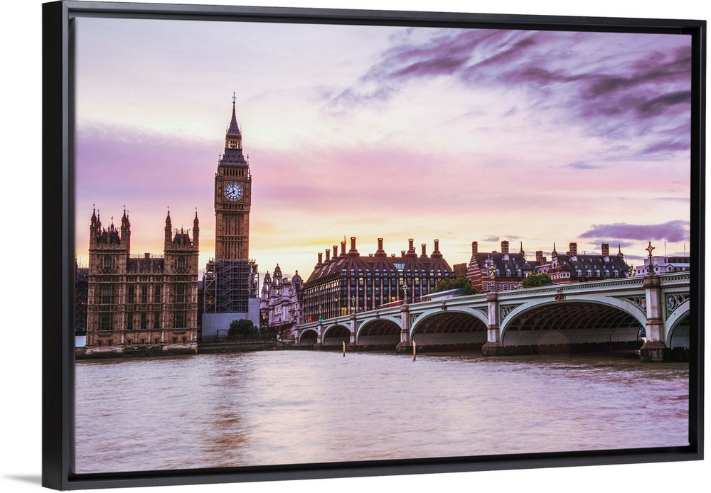 Photograph of Big Ben and the Westminster Bridge with a pink and purple sunset.