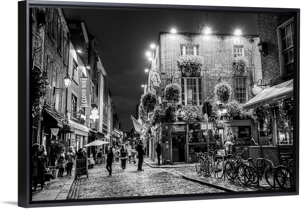 Photograph of Temple Bar, a busy riverside neighborhood in Dublin, Ireland, at night.
