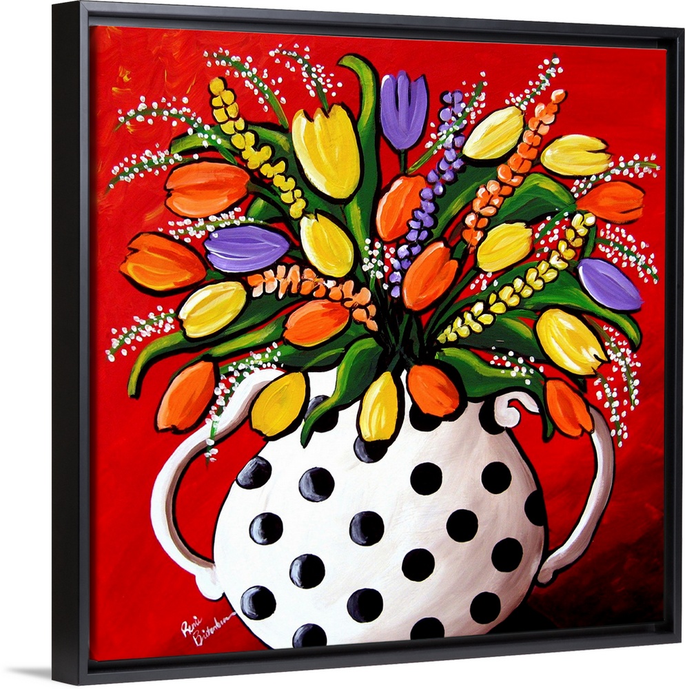 Fun, brightly colored polka dot vase filled with spring flowers and Tulips.
