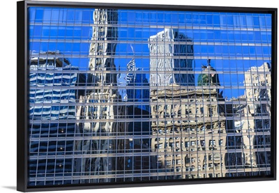 Buildings on West Wacker Drive reflected in the Trump Tower, Chicago, Illinois