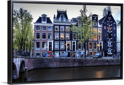 Old gabled houses line the Keizersgracht canal at dusk, Amsterdam, Netherlands