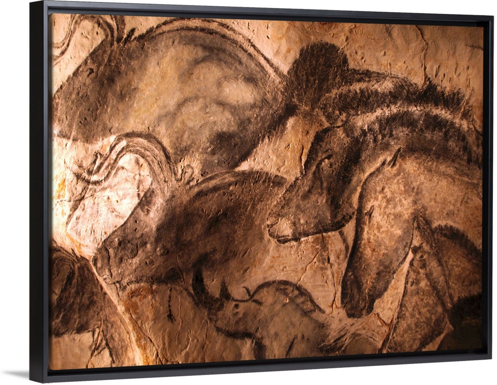 Stone-age cave paintings. Artwork depicting various animals painted on the wall of a cave. These paintings are found in th...