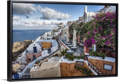 Bouganvillea and cafes on Oia, Santorini, Greece