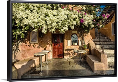 Cafe with bouganvillea in Oia, Santorini, Greece