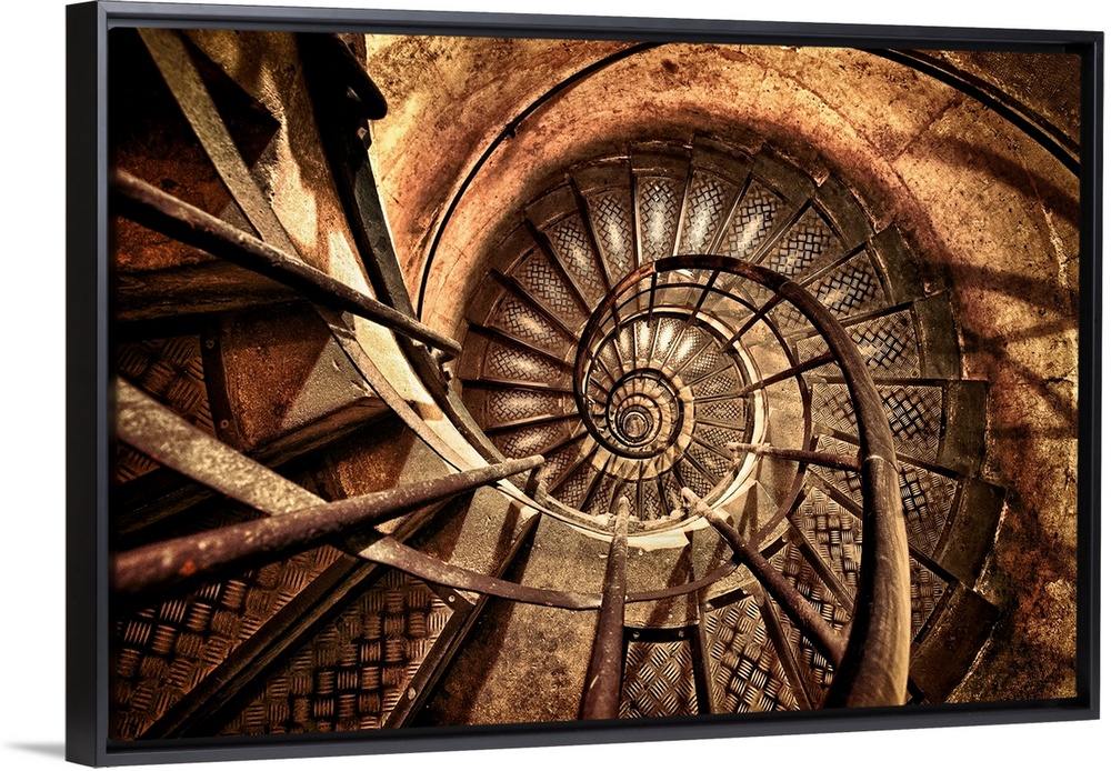 Photograph of a vintage flight of steps made of metal enclosed by brick that circles to the top of a brick column.