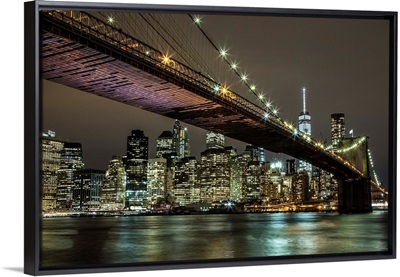 The Brooklyn Bridge and view of NYC after dark