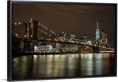 The Brooklyn Bridge and view of NYC after dark