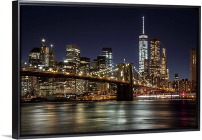 The Brooklyn Bridge and view of NYC after dark