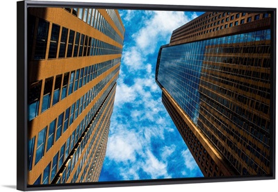 Looking up at Dallas skyscrapers from street level.