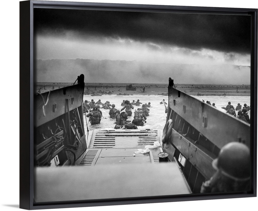 Digitally restored vintage World War II photo of American troops wading ashore on Omaha Beach during the D-Day invasion on...