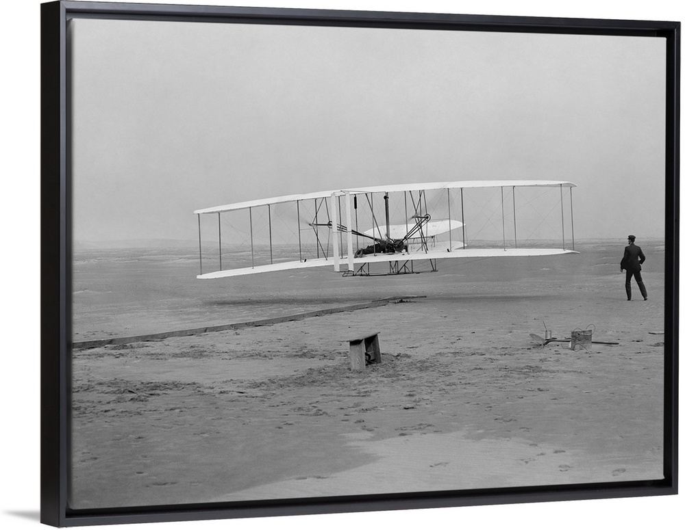 The first flight of the Wright Flyer in 1903.