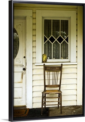 A chair on a porch