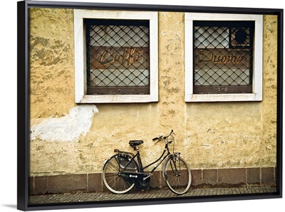 Bicycle on yellow wall