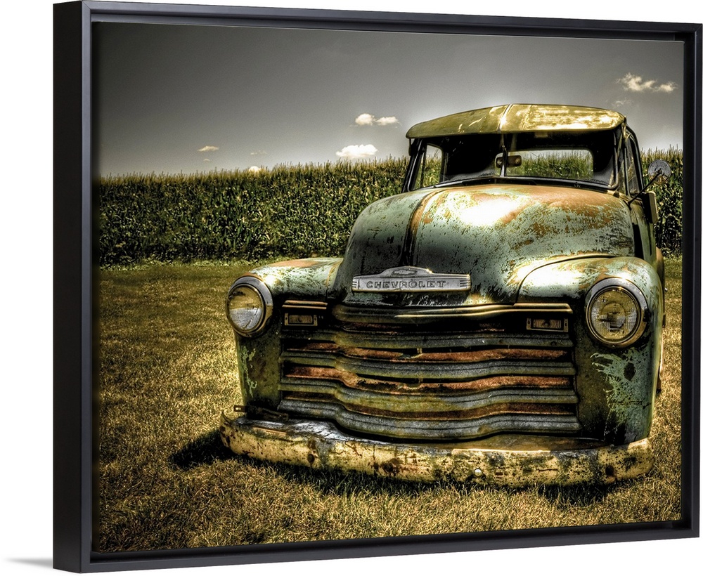 A photo on canvas of a vintage Chevrolet truck parked in front of a corn field.