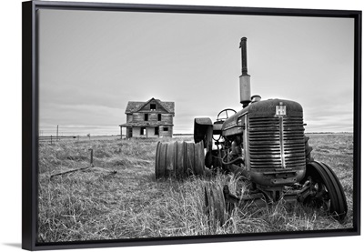 Derelict farm machinery with house in Pierce County, USA