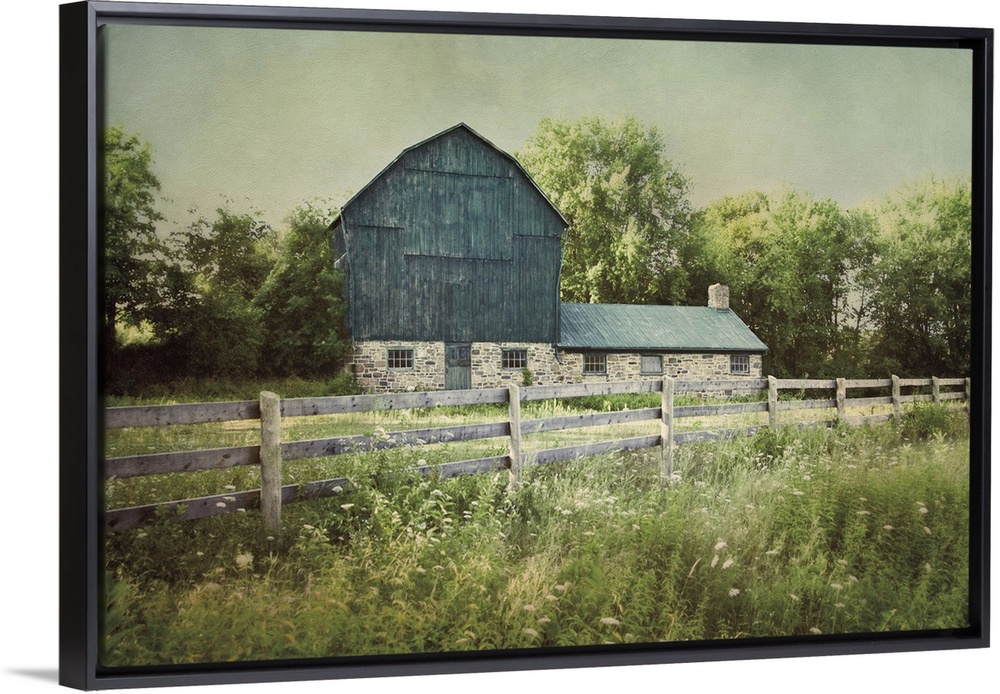 A photograph of a blue barn.