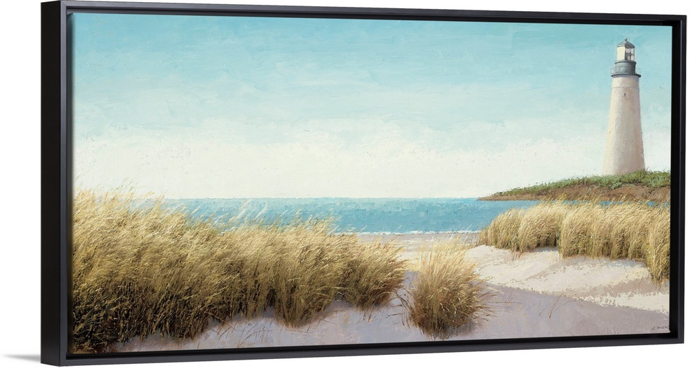 Horizontal, large wall picture of grasses blowing on the beach.  A lighthouse in the distance, next to blue waters.