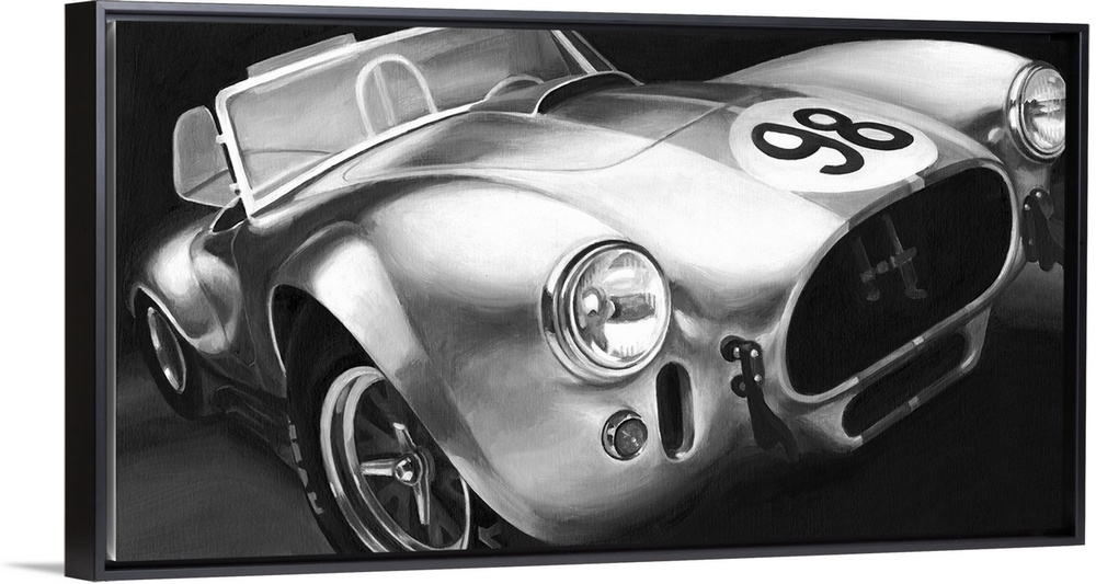 Photograph of classic muscle car with a convertible top and a 98 emblem circle on the hood.