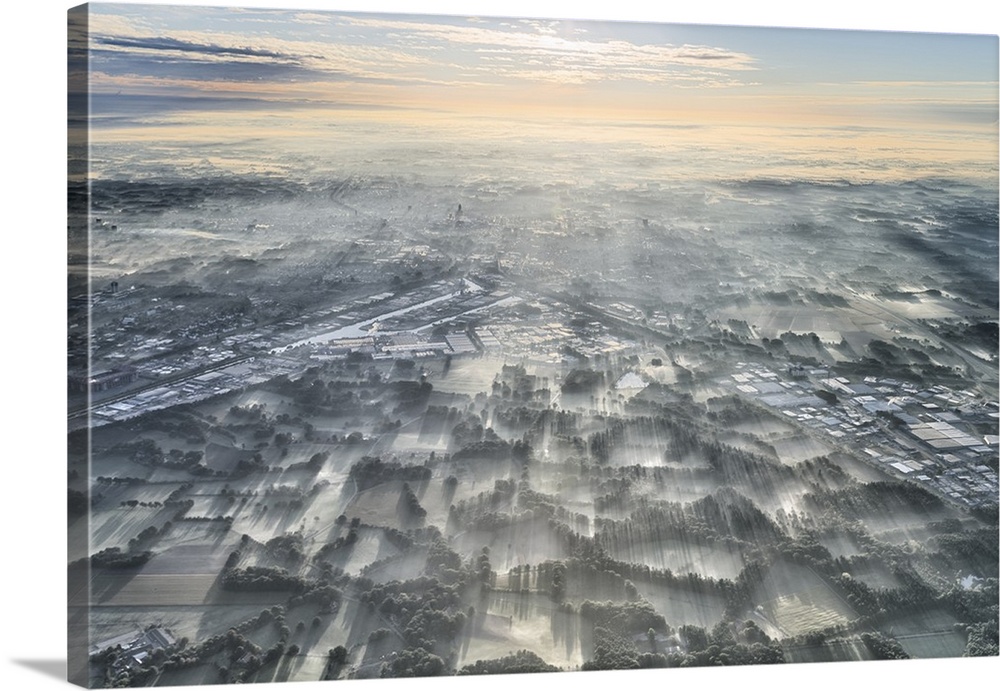 Aerial photograph of a misty morning over the Netherlands.