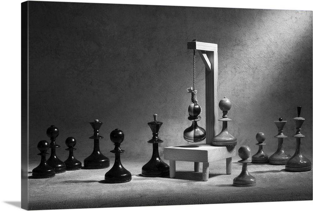 White and black chessmen hanging a pawn that is striped.
