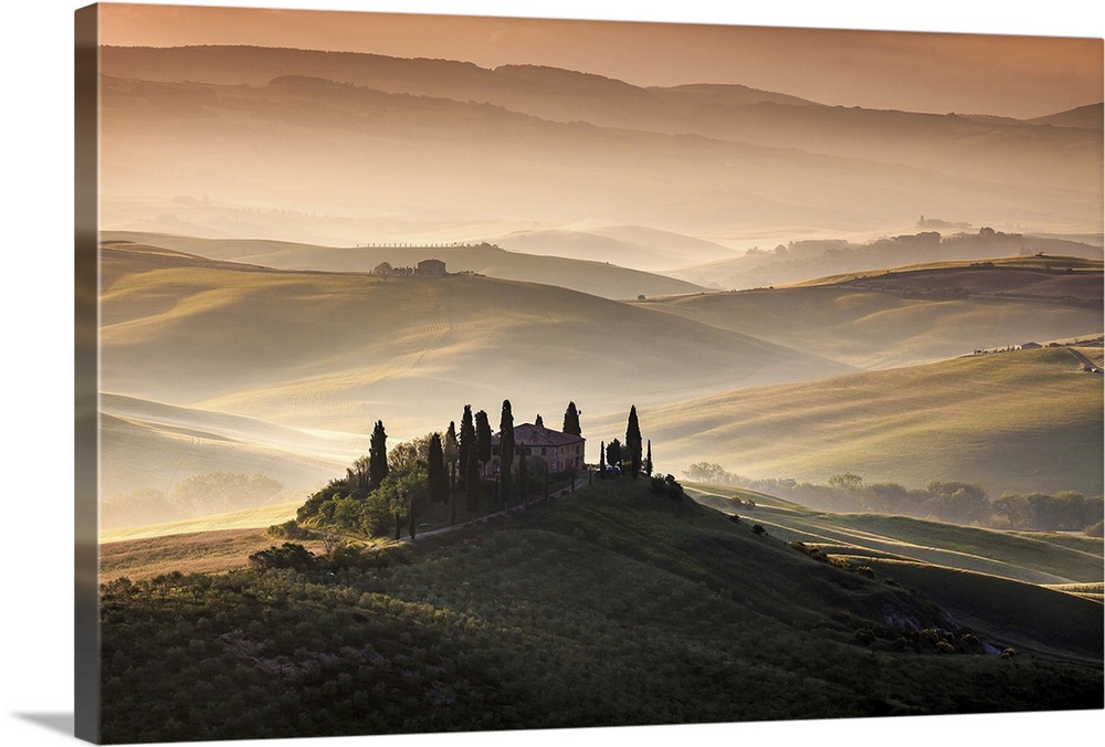 Idyllic landscape on a misty morning in the Tuscan countryside.