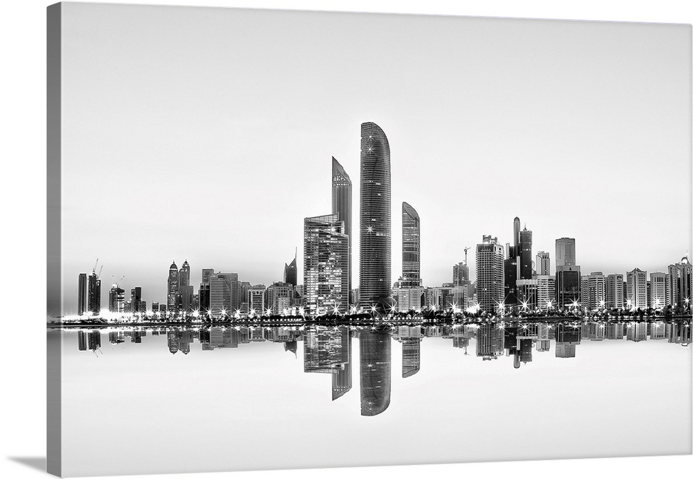 Mirror reflection of the Abu Dhabi skyline in the water below.