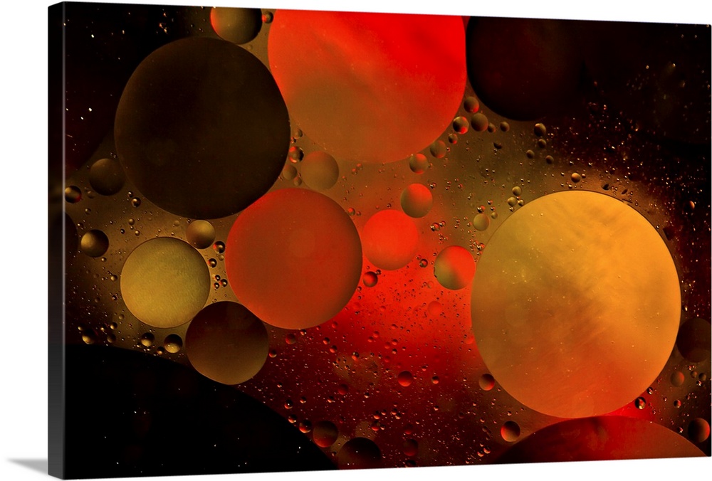 Abstract photograph of a warm red and orange colored water bubbles.