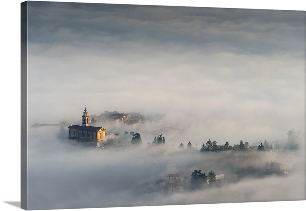 Dense fog blanketing the landscape of Almenno San Bartolomeo, Lombardy, Italy.