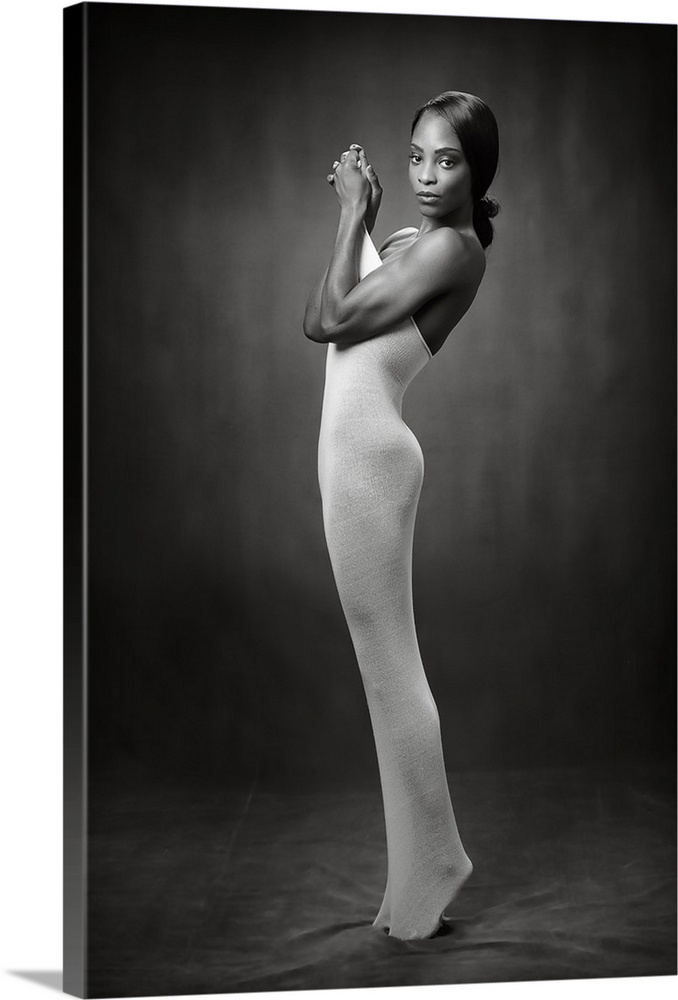 Elegant black and white photograph of a nude woman wearing a tight body sock.