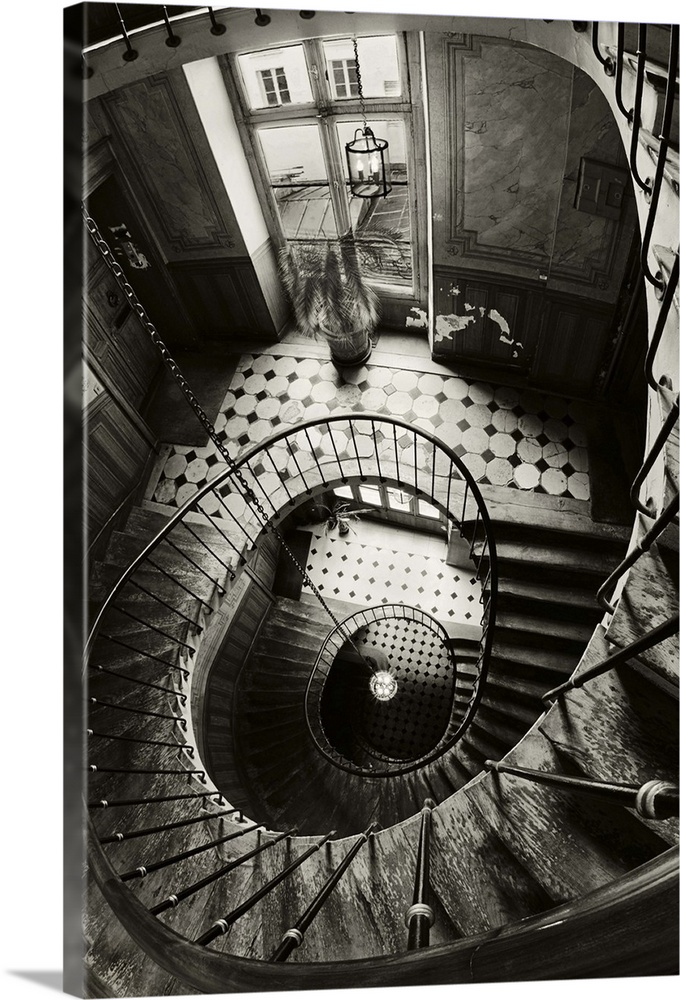 View through the center of a spiral staircase in Paris.