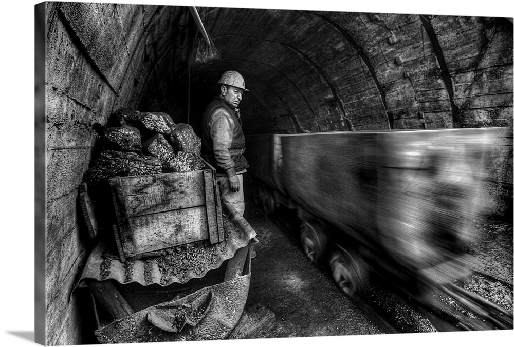 coal miners watching a mining cart whiz by in a cave.