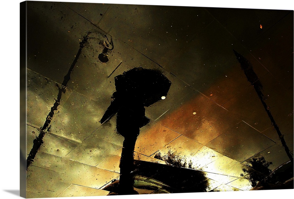 Photo of the reflection of a figure with an umbrella, streetlights, and colors of the sunset, viewed upside down, but appe...