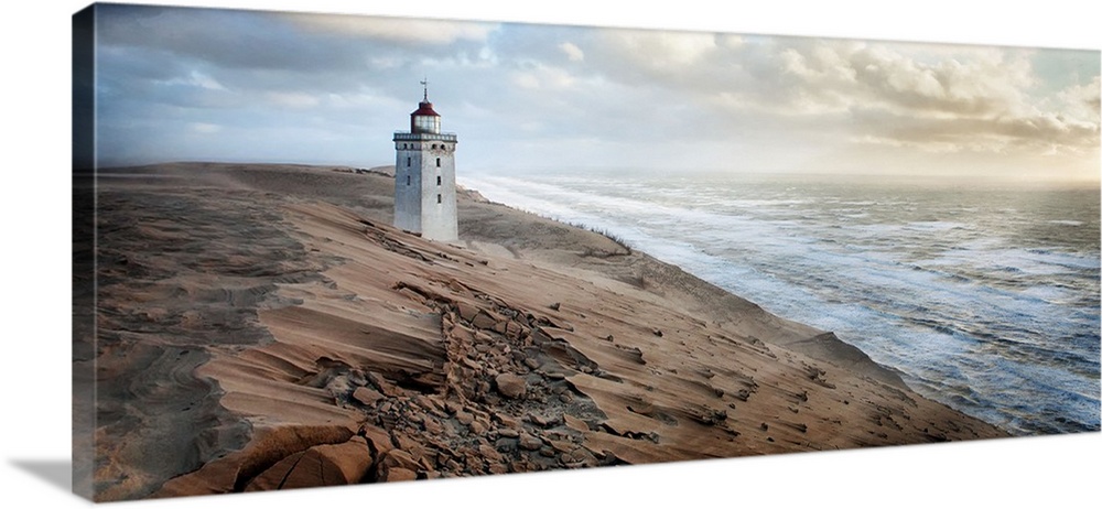 A lighthouse on the sandy coast of Denmark.