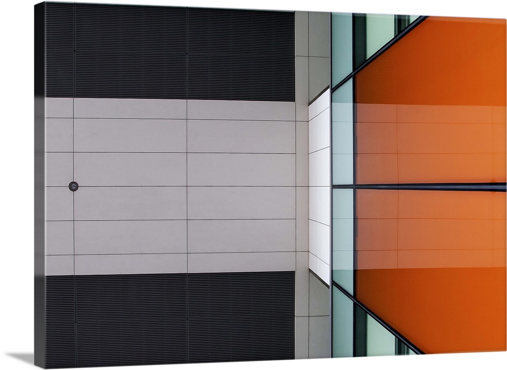 Orange glass and ceiling panels create an abstract image in Amsterdam.