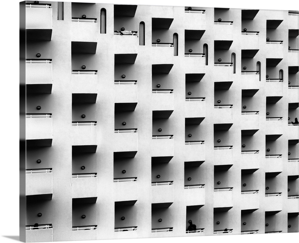 Black and white architectural abstract photograph of a facade full of balconies.