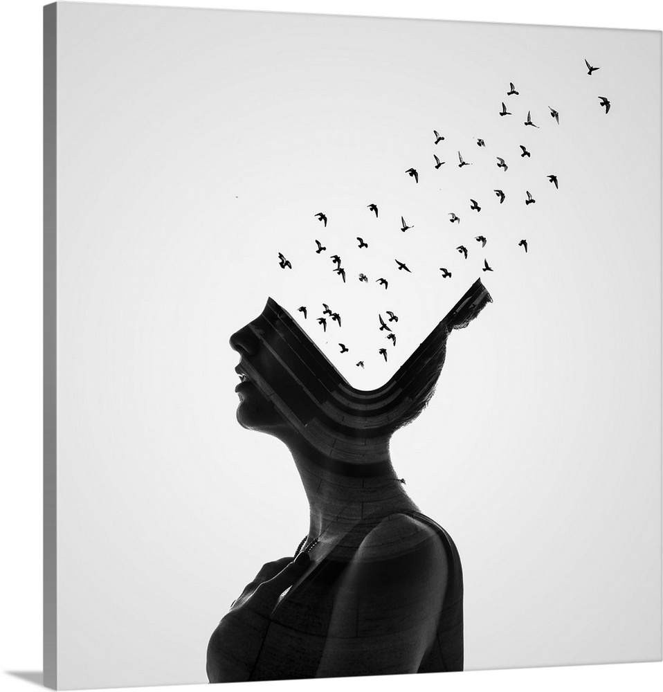 A conceptual photograph of a profile of a woman with birds flying from her head.
