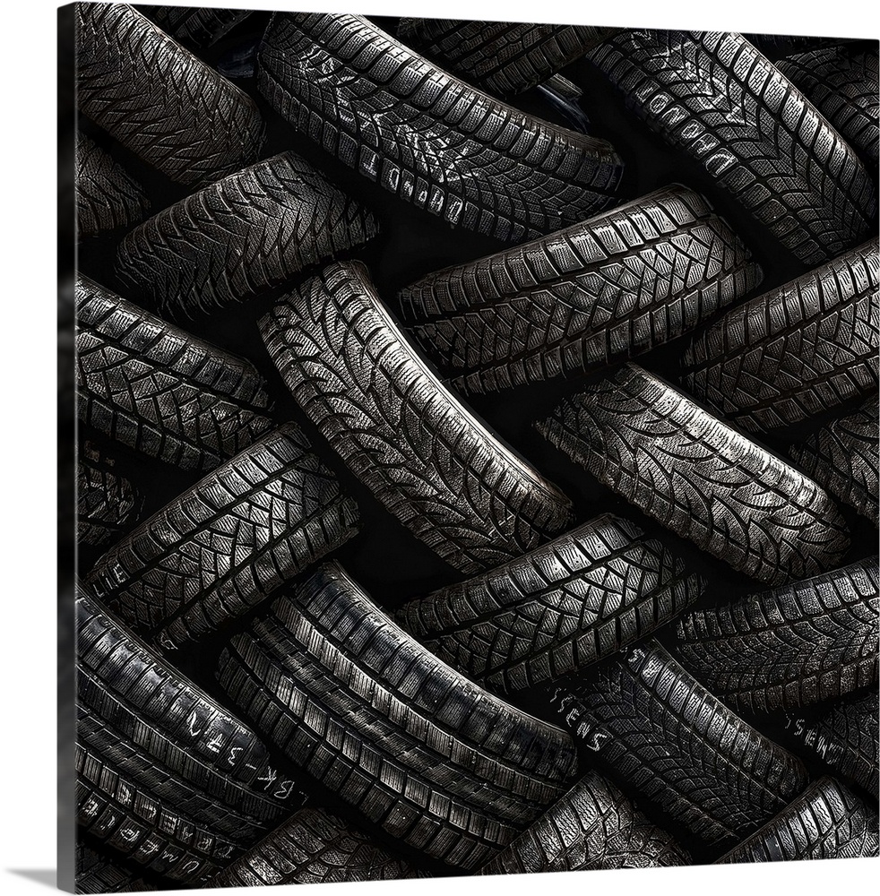 A stack of tires almost resembling intricate braids.