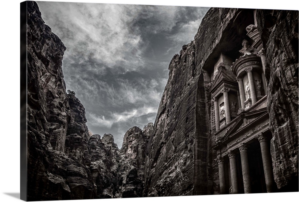 High contrast black and white image of the facade of the temple at Petra, Jordan.