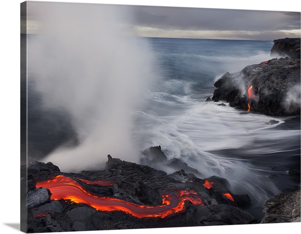 Lava flowing into the ocean, creating large amounts of steam, Hawaii.