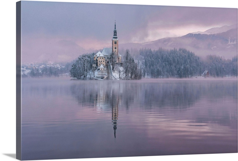 Lake Bled with the church and the castle on a calm winter morning.