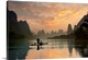 image thumbnail of A fisherman and his cormorants on a boat in the Li River at dawn, China.
