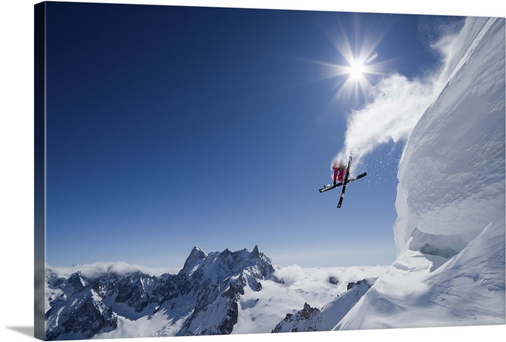 Skier Guerlain Chicherit jumping off a snowy cliff, Chamonix, France