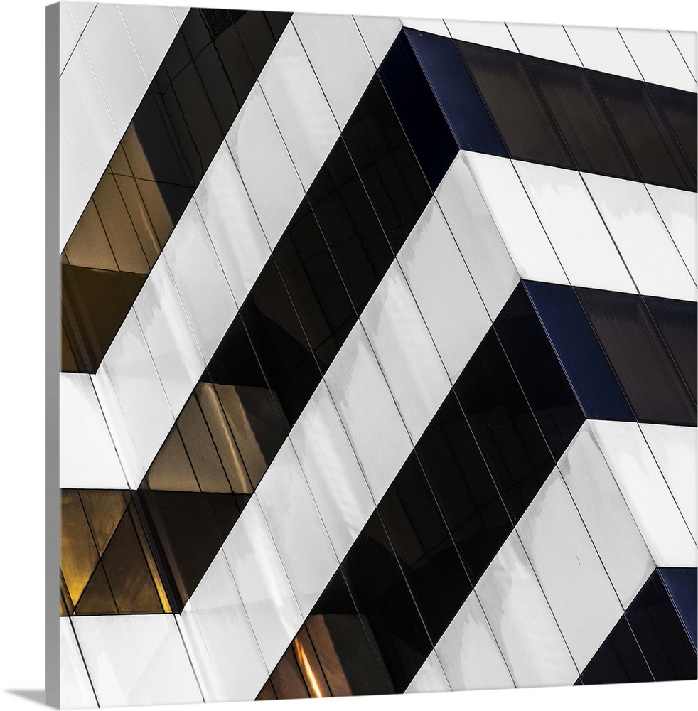 Square fine art photograph of part of a black and white striped building facade.